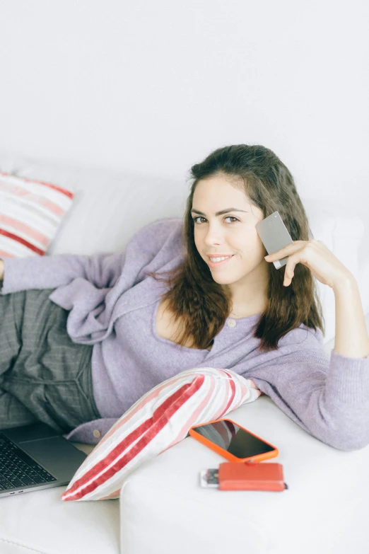 a woman laying on a couch talking on a cell phone, streaming on twitch, wearing casual clothing, promo image, h3h3