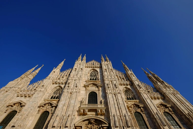 a very tall cathedral with a clock on it's side, by Carlo Martini, pexels contest winner, renaissance, milan schere, clear blue skies, 15081959 21121991 01012000 4k, frontal picture