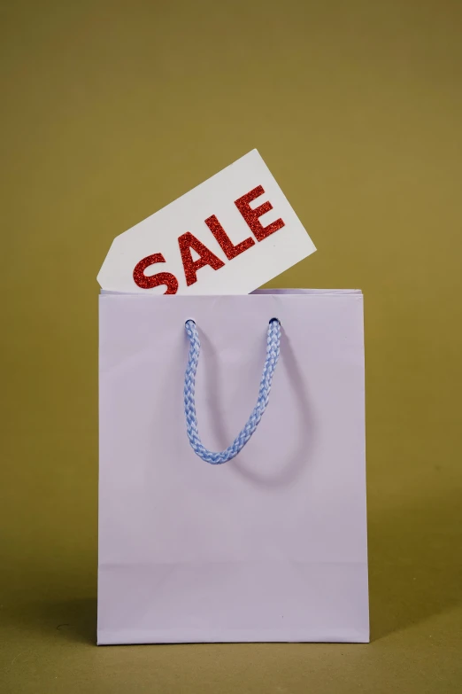 a shopping bag with a sale sign sticking out of it, a photo, trending on unsplash, hyperrealism, thumbnail, pastel', display item, medium format. soft light