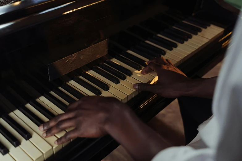 a close up of a person playing a piano, emmanuel shiru, light toned, multiple stories, thumbnail