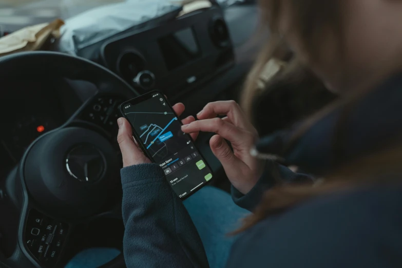 a person using a cell phone in a car, pexels contest winner, square, charts, 12k, ad image