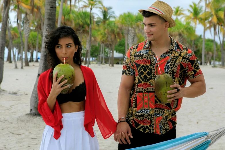 a man and woman standing next to each other on a beach, coconuts, episode, violet myers, hispanic