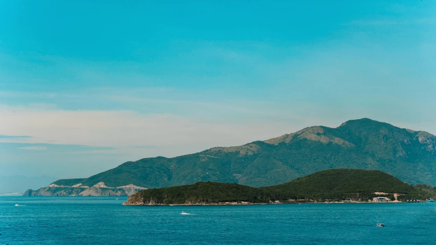 a large body of water with a mountain in the background, by Exekias, pexels contest winner, happening, picton blue, croatian coastline, profile image, ultrawide landscape