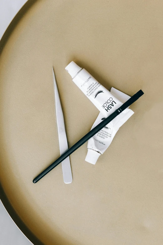 a pair of scissors sitting on top of a plate, a charcoal drawing, inspired by Maki Haku, unsplash, complimentary eyeliner, product view, soft white rubber, spatula