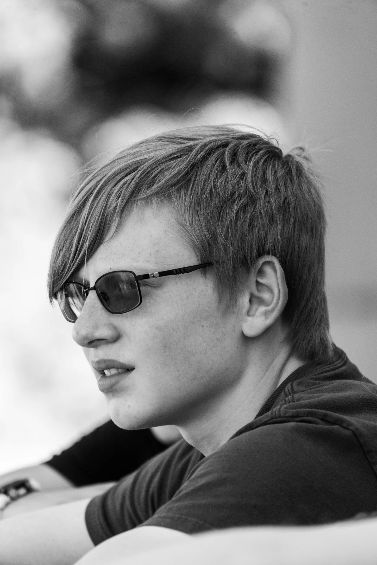 a black and white photo of a man wearing sunglasses, a black and white photo, inspired by Aleksander Gine, reddit, realism, red haired teen boy, profile photo, blonde man, vitalik buterin