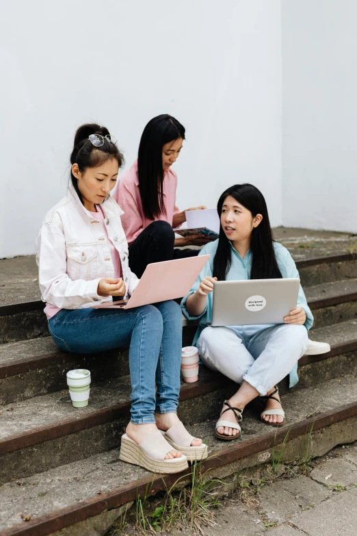 a group of women sitting on steps with laptops, by helen huang, trending on pexels, young asian girl, teaching, coloured photo, profile image