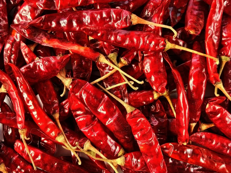 a pile of red chili peppers sitting on top of each other, avatar image, india, crisp image, 🦩🪐🐞👩🏻🦳