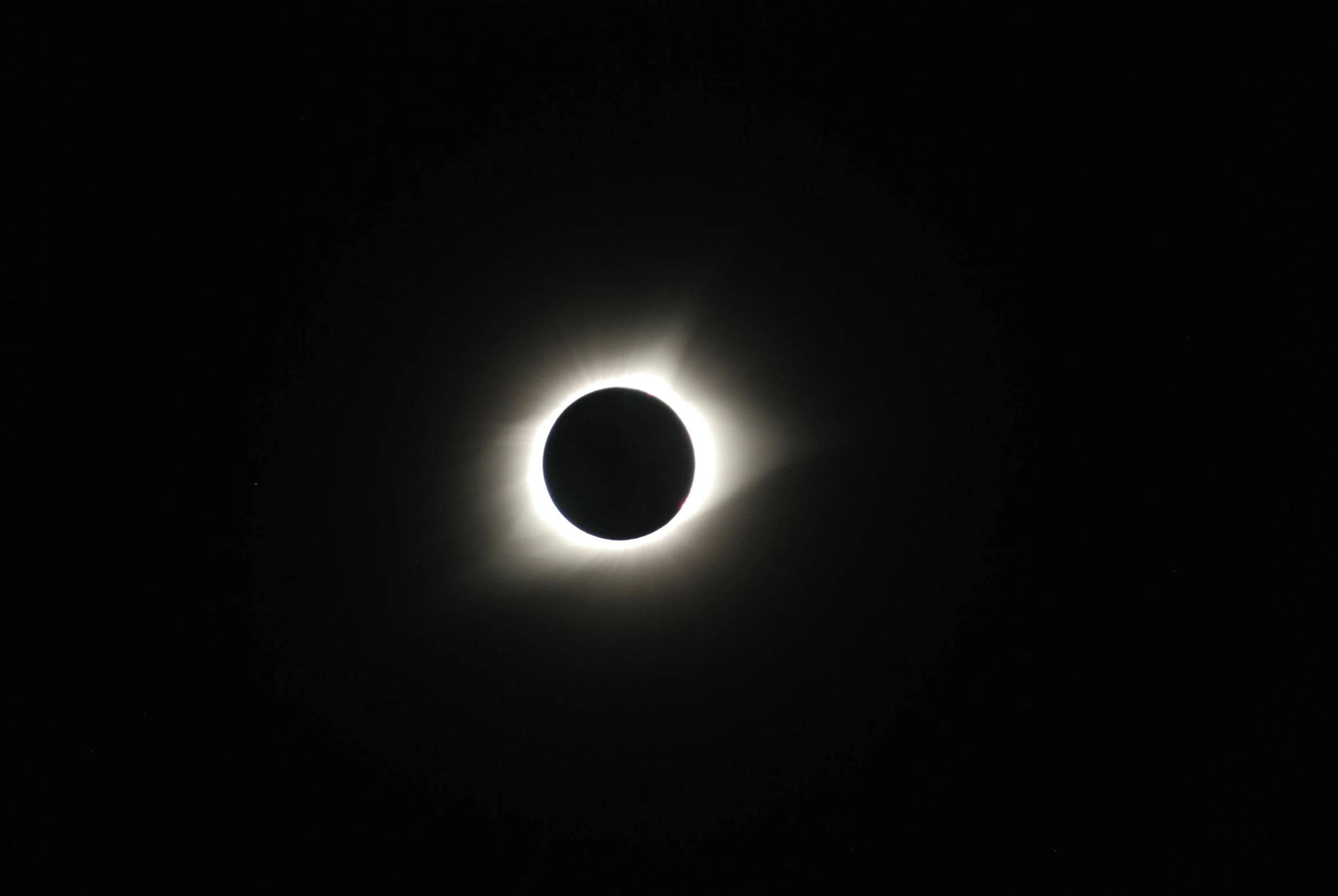 a black and white photo of a solar eclipse, by Niko Henrichon, pexels contest winner, hurufiyya, prize winning color photo, cell phone photo, 1 0 mm lens, 300mm lense