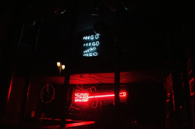 a neon sign on the side of a building, by Elsa Bleda, pexels contest winner, neo-figurative, inside a bar, red on black, hugo pratt, mangeta smoke red light