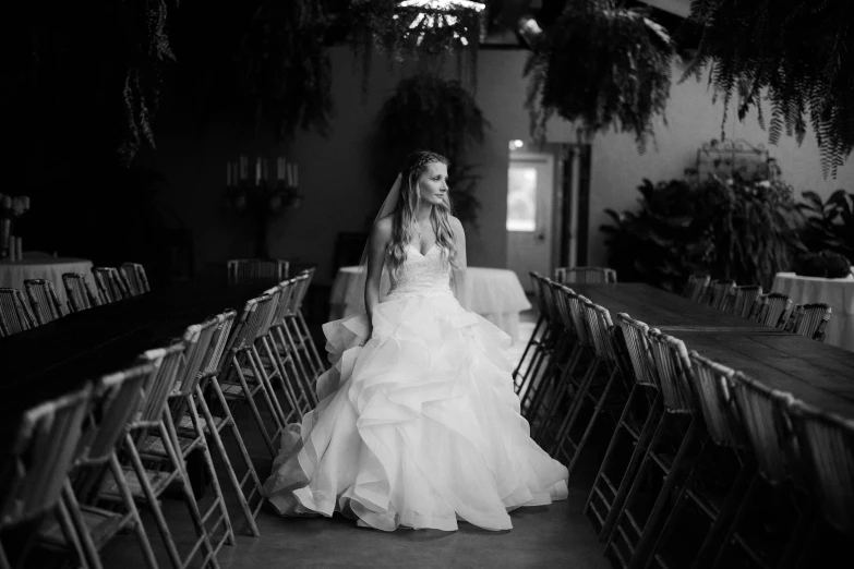 a black and white photo of a woman in a wedding dress, by Caroline Mytinger, unsplash, indoor setting, lush surroundings, ruffles, ❤🔥🍄🌪