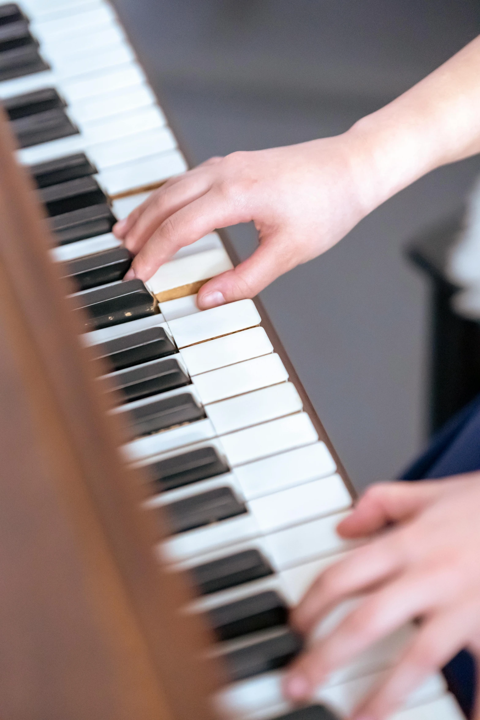 a close up of a person playing a piano