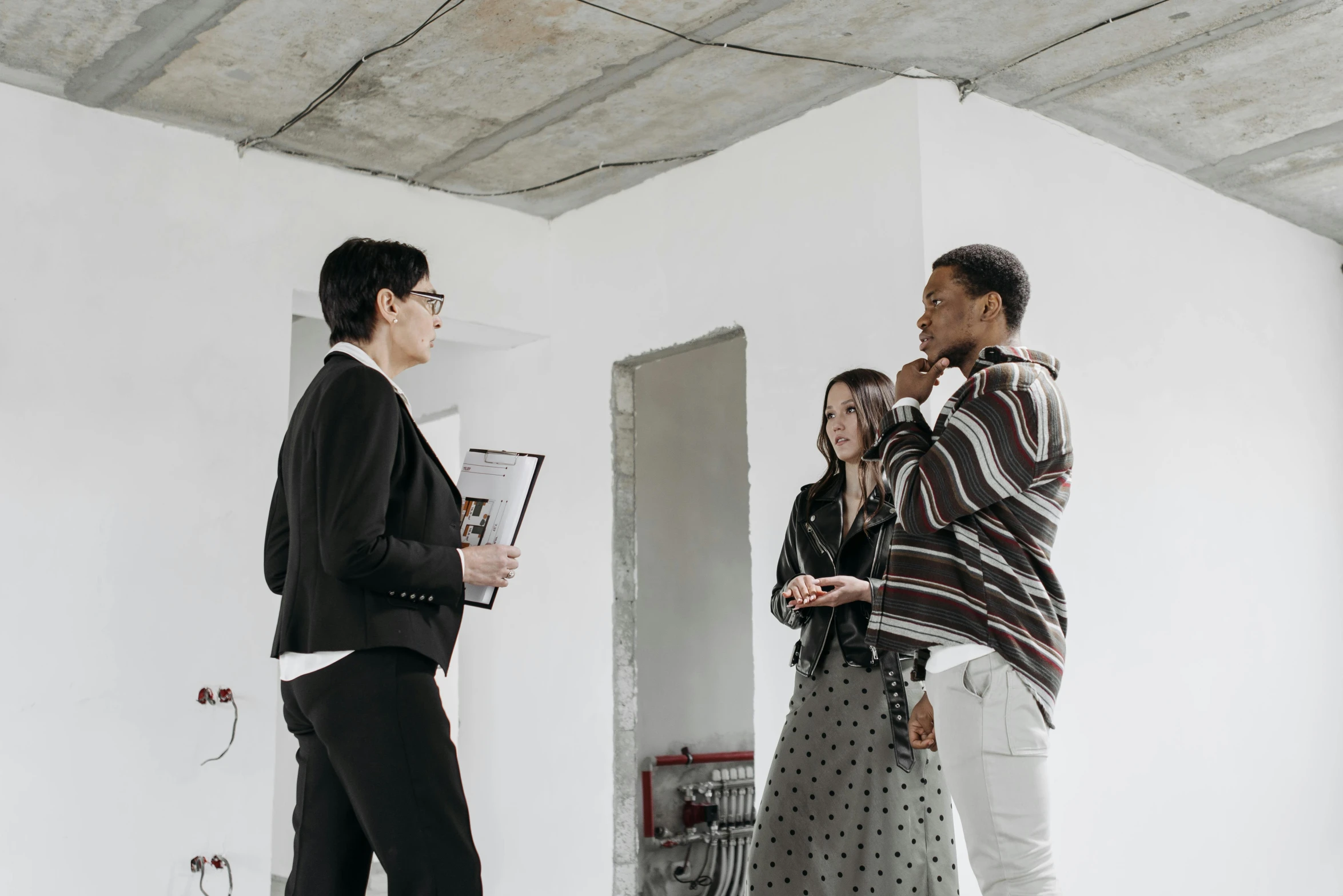 a group of people standing in a room, in a white room, styling, coworkers, very tall