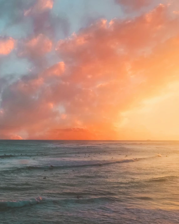 a man riding a surfboard on top of a wave, an album cover, pexels contest winner, romanticism, rainbow clouds, sunset panorama, beach aesthetic, the sky is pink