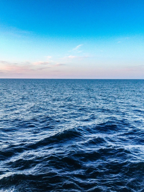 a view of the ocean from a boat, by Christen Dalsgaard, pexels contest winner, 2 5 6 x 2 5 6 pixels, looking left, widescreen, early evening