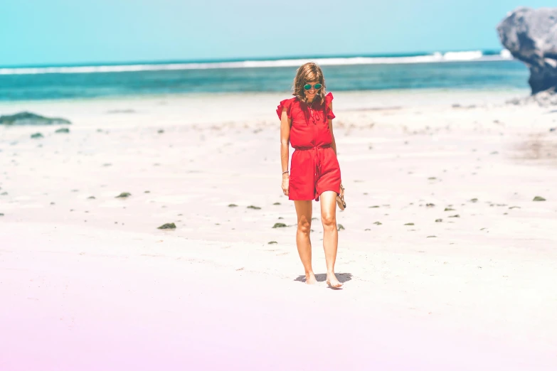 a woman in a red dress walking on a beach, pexels contest winner, shades of pink and blue, australian beach, red jumpsuit, with instagram filters