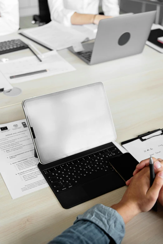 a person sitting at a desk working on a laptop, a computer rendering, pexels contest winner, holding a clipboard, technical document, glossy surface, no - text no - logo