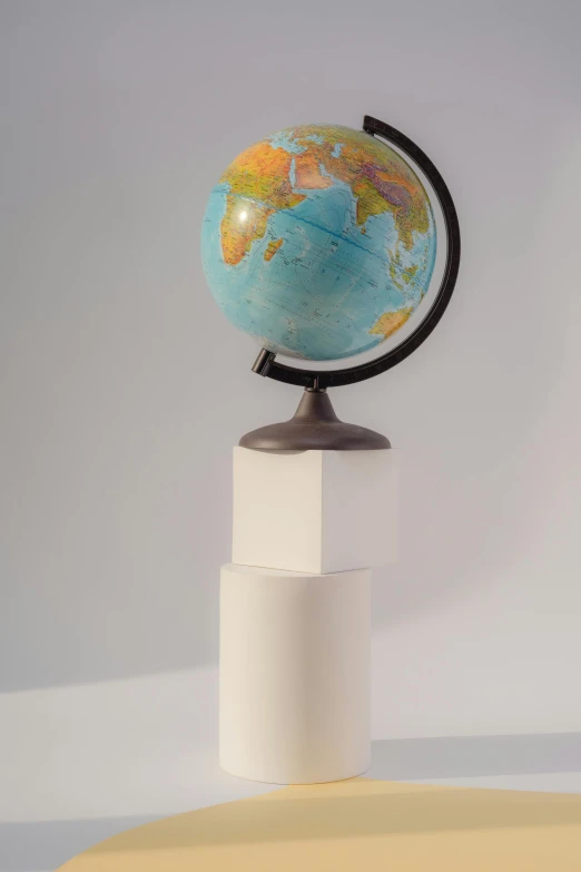 a globe sitting on top of a white pedestal, award winning hyperrealistic, 2019 trending photo, educational display case, high angle