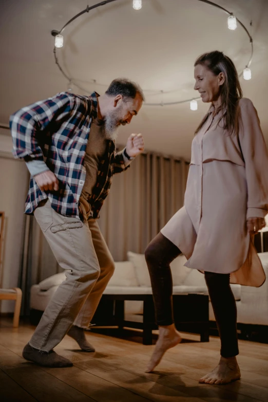 a man and a woman dancing in a living room, pexels contest winner, happening, about to step on you, profile image, daddy energy, ( ( theatrical ) )