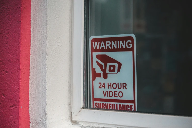 a sign warning of 24 hour video surveillance, a poster, by Everett Warner, pexels, window, bad camera footage, footage