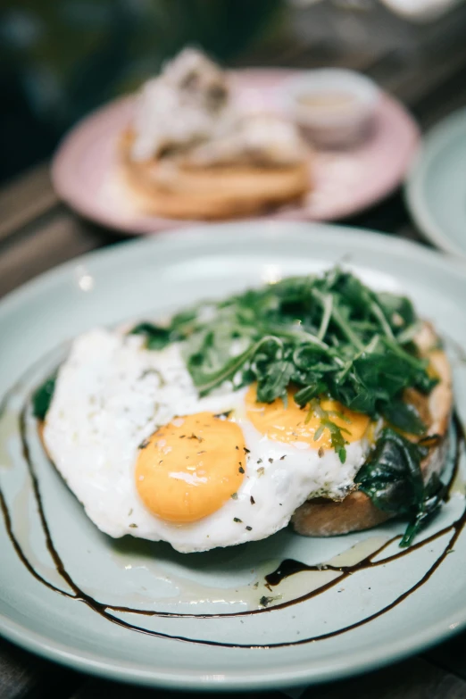 a close up of a plate of food on a table, by Austin English, unsplash, an egg, melbourne, longque chen, toast