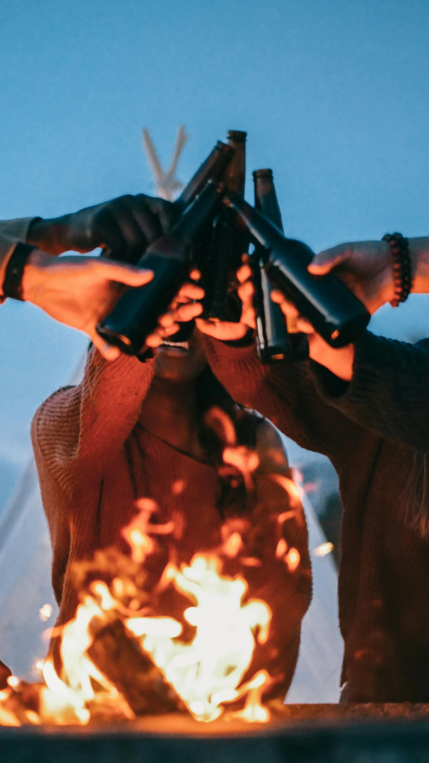 a group of people standing around a fire, shotguns, unsplash contest winning photo, flasks in hands, avatar image