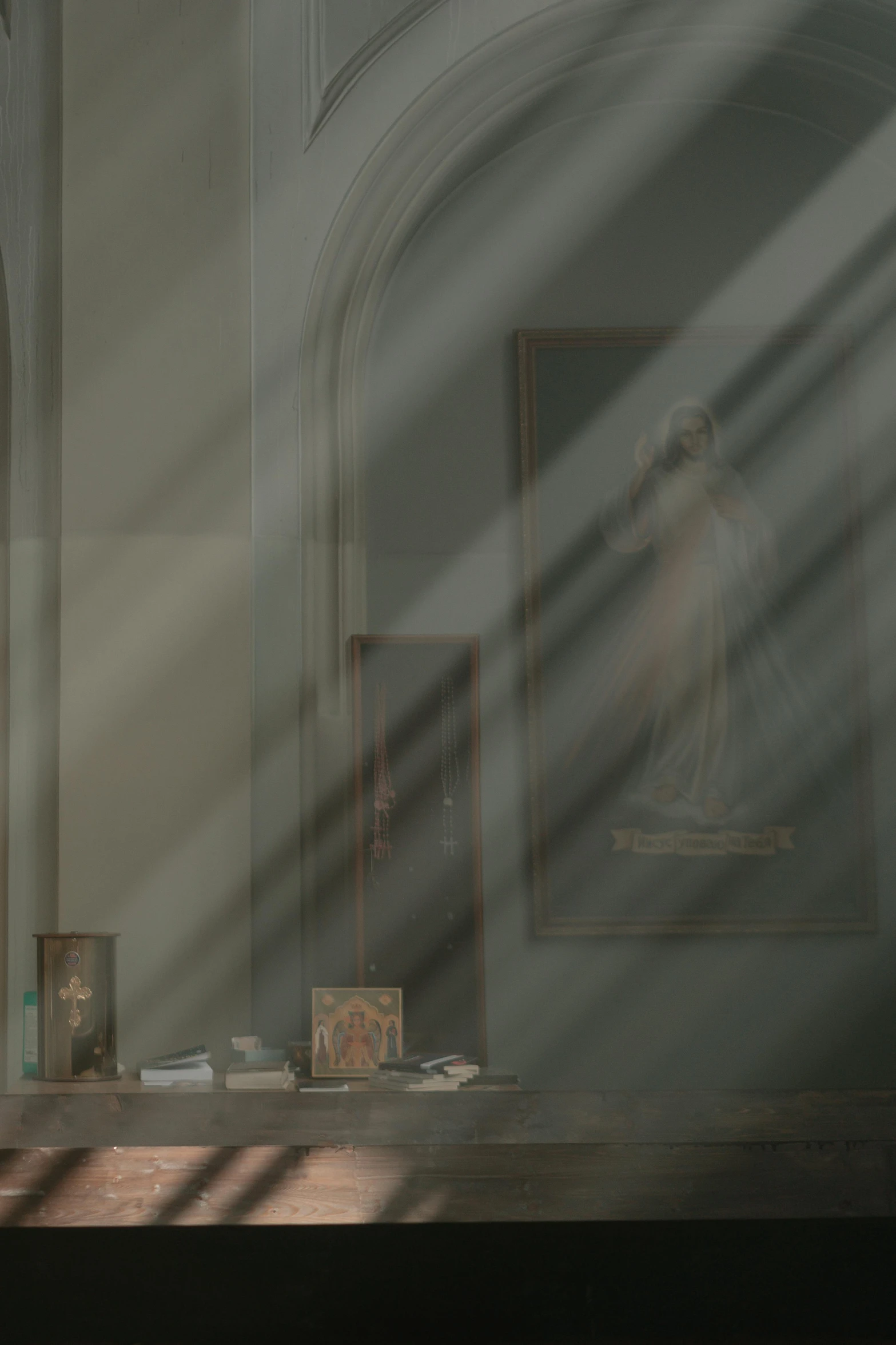 a cat sitting on top of a table next to a window, a painting, by Eglon van der Neer, pexels contest winner, light and space, holy sacred light rays, dusty library, shadow cast of dark corridor, displayed on an altar