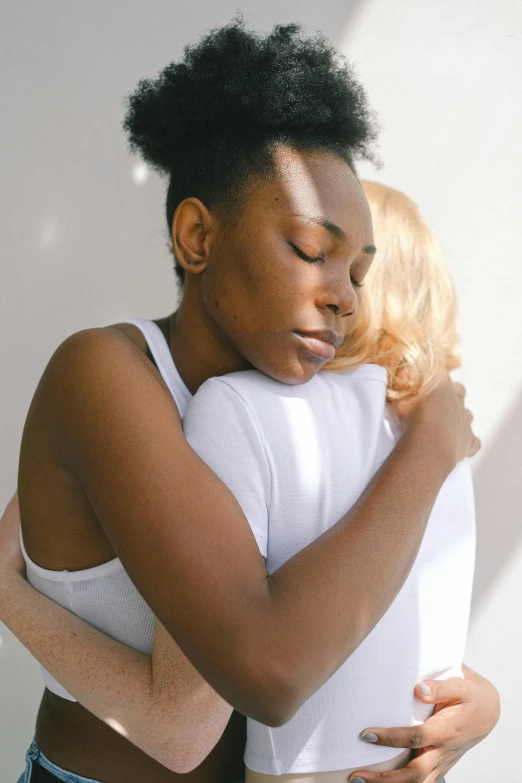 a couple of women standing next to each other, trending on pexels, romanticism, hugging and cradling, portrait of ororo munroe, recovering from pain, 15081959 21121991 01012000 4k