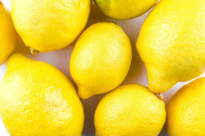 a bunch of lemons sitting on top of each other, trending on pexels, background image, thumbnail