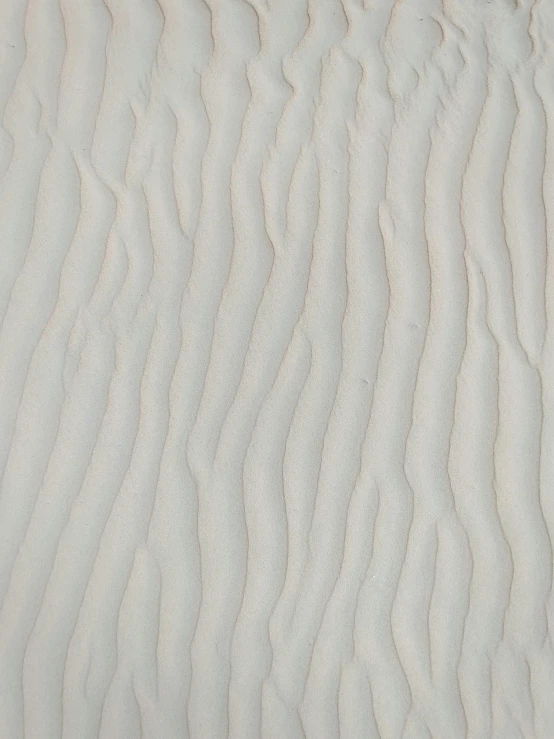 a red fire hydrant sitting on top of a sandy beach, an ultrafine detailed painting, inspired by Agnes Martin, reddit, op art, pale white detailed reptile skin, organic ceramic white, bas - relief, rippling