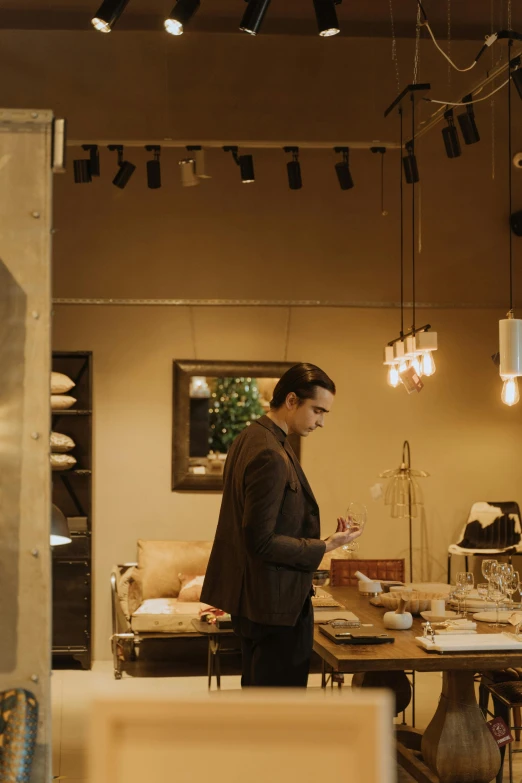 a man that is standing in a room, plating, dezeen showroom, cosy atmosphere, objects well lit