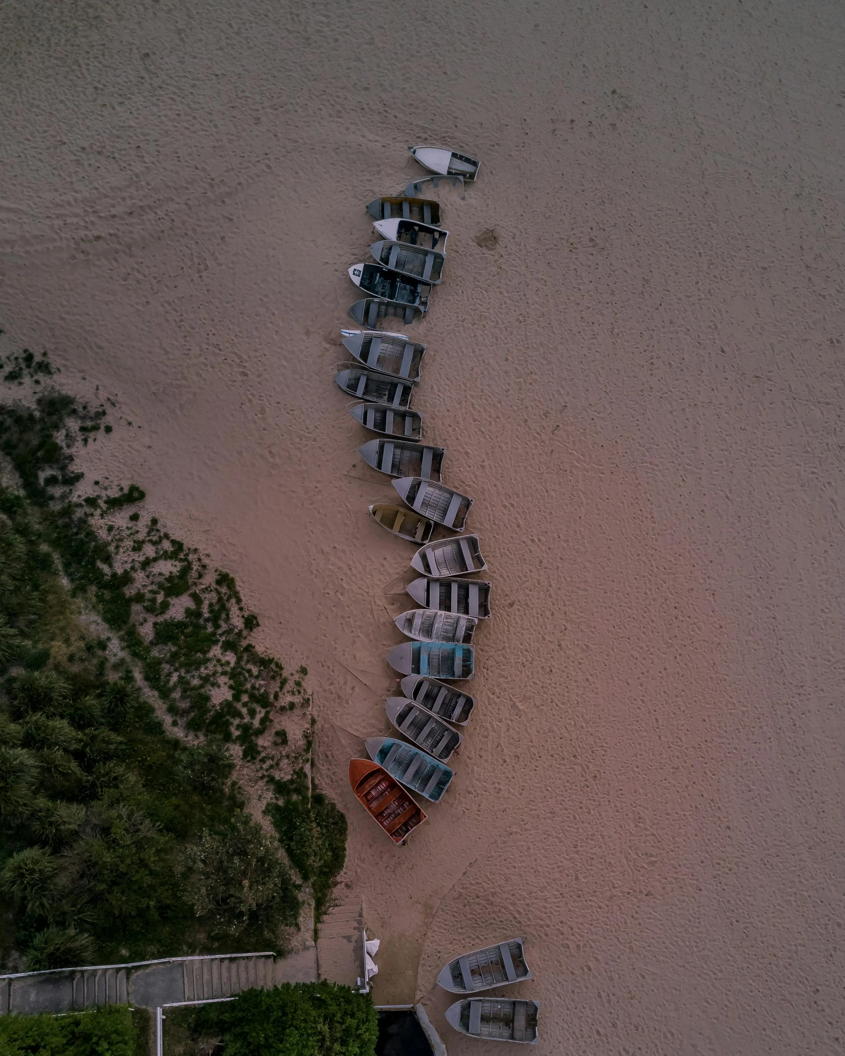 a group of boats sitting on top of a sandy beach, by Attila Meszlenyi, unsplash contest winner, land art, parked cars, abel tasman, thumbnail, multiple stories