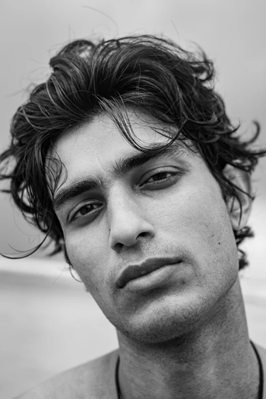 a black and white photo of a young man, by Ismail Acar, riccardo scamarcio, zaha hadi, square masculine facial features, joseph joestar