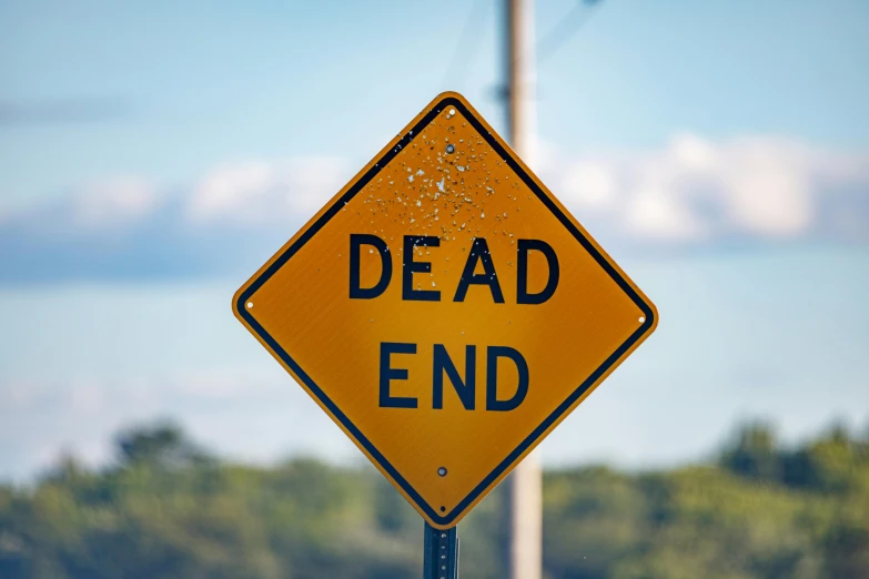 a dead end sign sitting on the side of a road, trending on unsplash, happening, square, bedhead, crashed, ignant