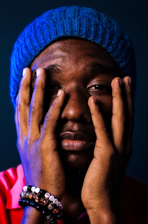 a man holding his hands to his face, an album cover, by Bascove, unsplash, visual art, mrbeast, portrait mode photo, lil uzi vert, stressed expression