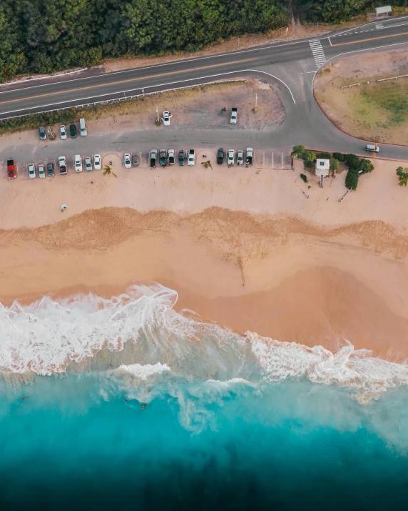 an aerial view of a beach with cars parked on it, pexels contest winner, lgbtq, ( ( ( kauai ) ) ), panels, gif