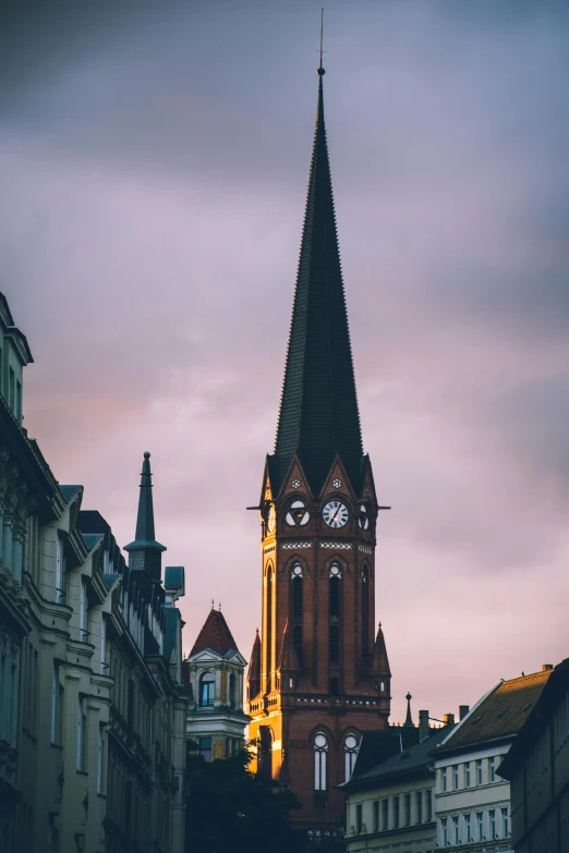 a tall clock tower towering over a city street, by Jan Tengnagel, trending on unsplash, art nouveau, lead - covered spire, moody evening light, detmold, square