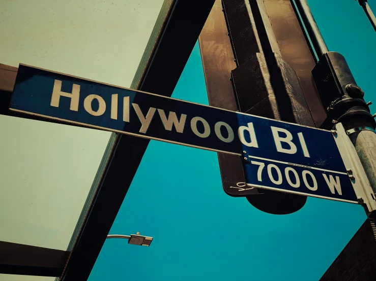 a close up of a street sign on a pole, a colorized photo, unsplash, hollywood promotional image, 🚿🗝📝