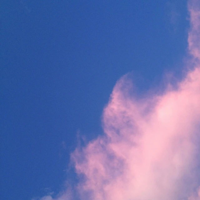 a plane that is flying in the sky, an album cover, by Jan Rustem, unsplash, aestheticism, blue and pink shift, peaceful cloud, late summer evening, dayglo pink blue