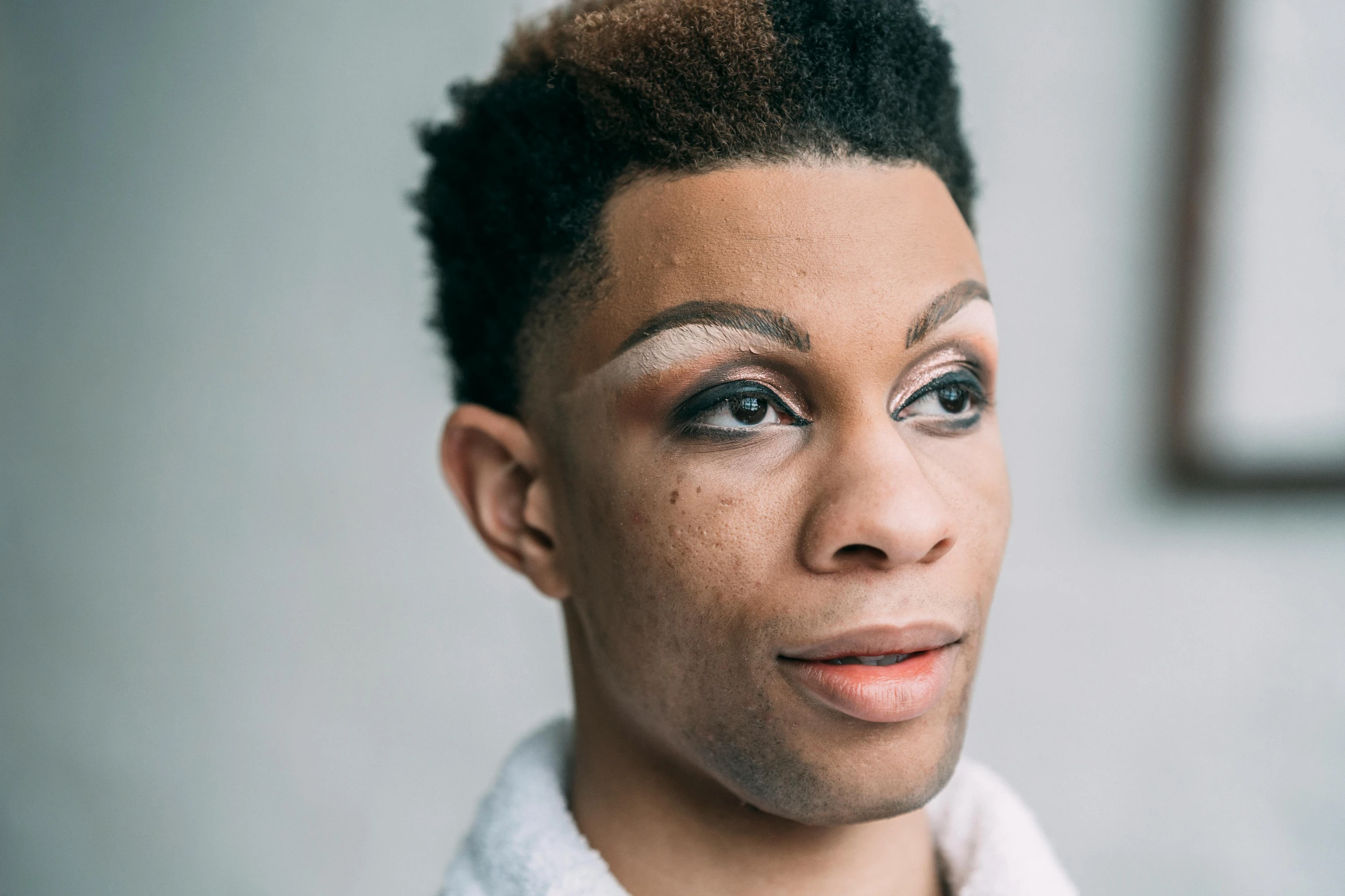 a close up of a person wearing a bathrobe, by Cosmo Alexander, androgynous male, riyahd cassiem, with professional makeup, terence nielsen