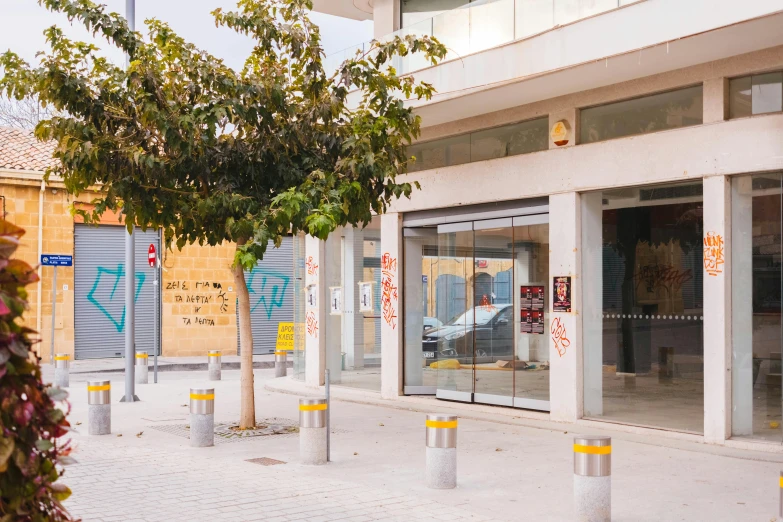 a red fire hydrant sitting on the side of a street, a cartoon, unsplash, temporary art, modern lush condo as shopfront, cyprus, panoramic shot, dezeen showroom
