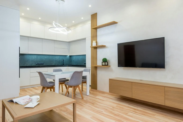 a living room filled with furniture and a flat screen tv, by Adam Marczyński, pexels contest winner, light and space, minimal kitchen, blue light accents, wood cabinets, high detail 4k