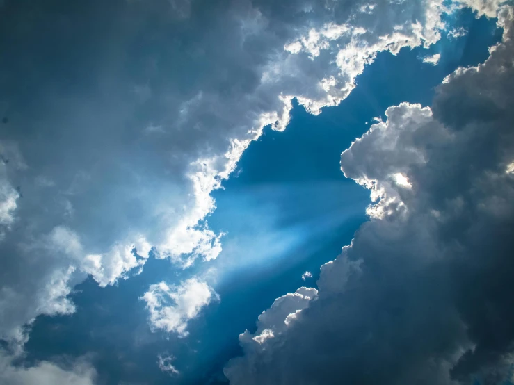 the sun is shining through the clouds in the sky, by Jan Rustem, pexels contest winner, light and space, dramatic blue light, paul barson, dramatic angle, today's featured photograph 4k