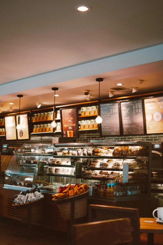 a bakery filled with lots of different types of food, starbucks, professional photo, thumbnail, comfy ambience