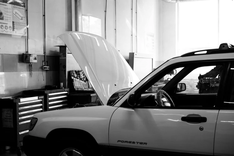 a black and white photo of a car with its hood open, process art, soft color dodge, maintenance area, profile image, iroc