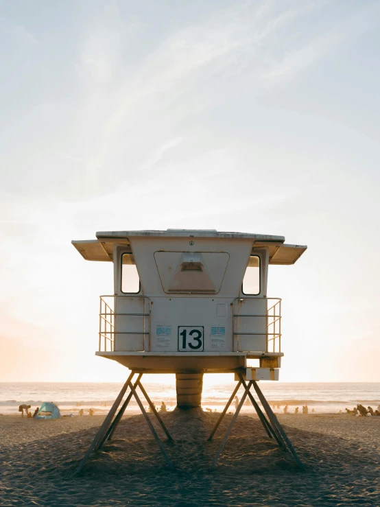 a lifeguard tower sitting on top of a sandy beach, by Jacob Burck, unsplash contest winner, golden hour in pismo california, profile image, beachwood treehouse, full front view