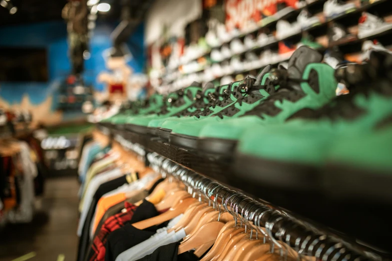 a row of clothes on a rack in a store, by Niko Henrichon, unsplash, maximalism, acid-green sneakers, “air jordan 1, lots of shops, inspect in inventory image