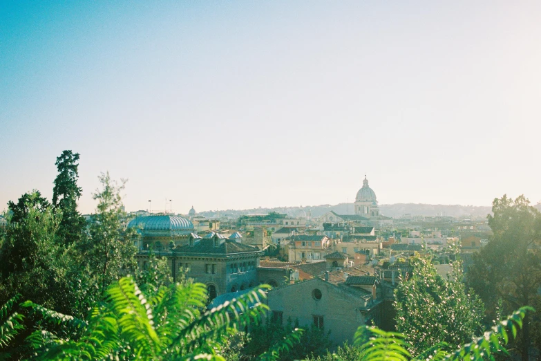 a view of a city from the top of a hill, pexels contest winner, renaissance, amongst foliage, rome, sunfaded, portra