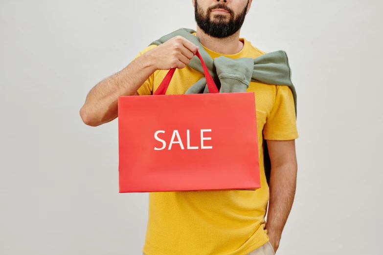 a man holding a red bag with a sale written on it, instagram, scarlet and yellow scheme, no - text no - logo, thumbnail, colour print