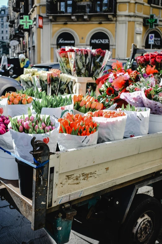 a truck filled with lots of different types of flowers, tulips, platforms, stockholm, fan favorite