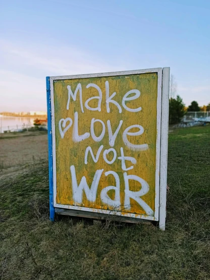 a sign that says make love not war, by Miroslava Sviridova, outdoor photo, thumbnail, camp, portlet photo